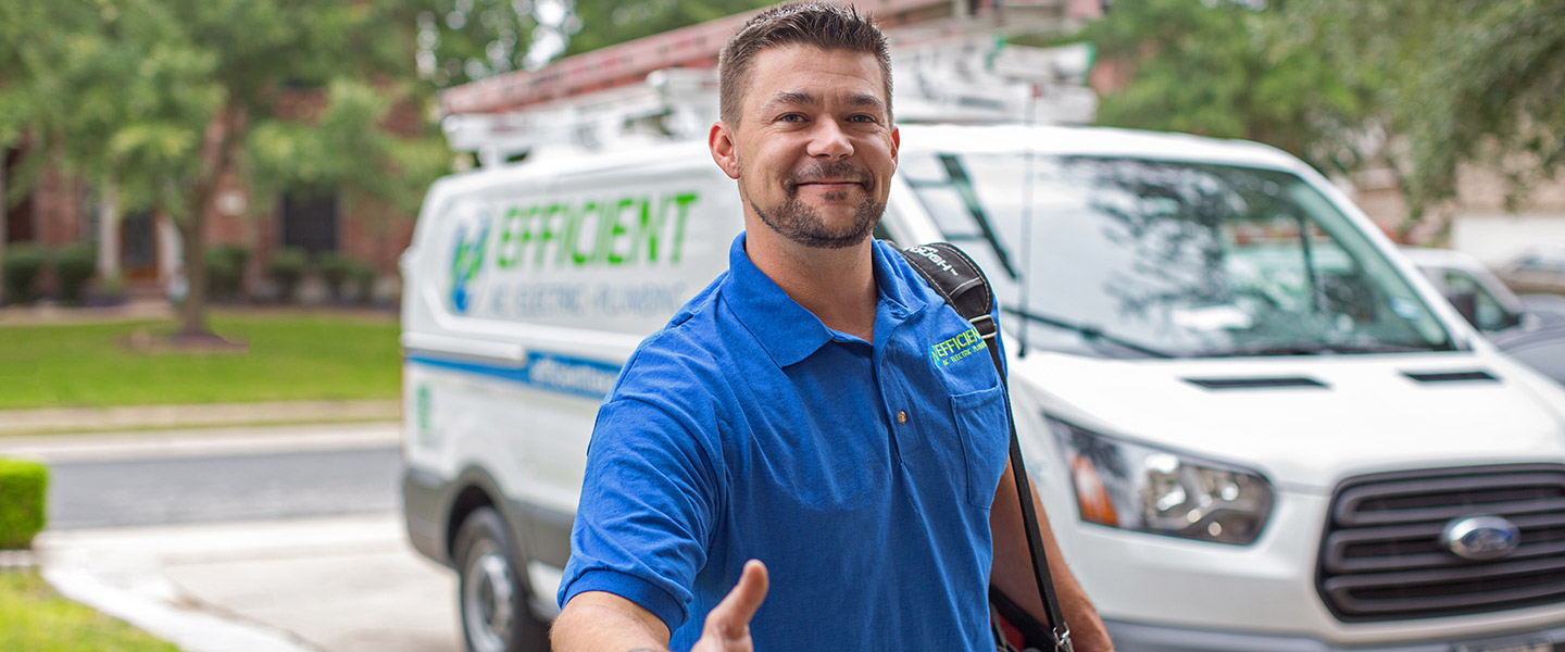 man in front of Efficient AC van reaching out to shake hands